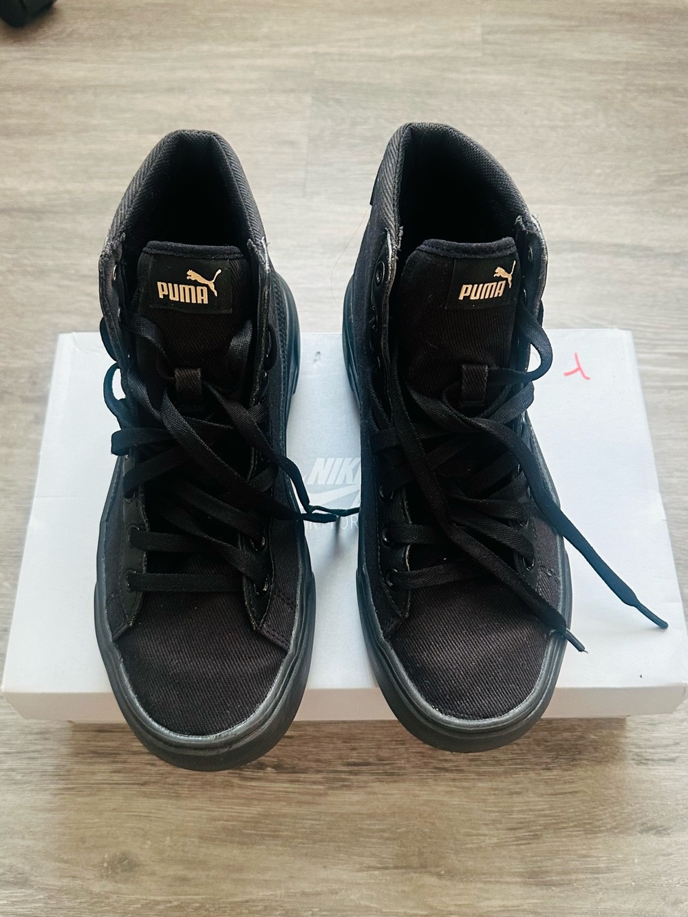 Puma Black High-Top Sneakers with Gold Logo Accent
